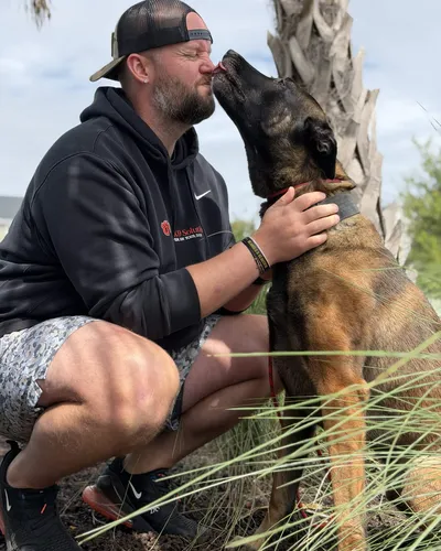 Zack Barkley with a Belgian Malinois